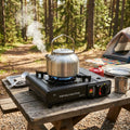 VortexFlow Cassette Stove in use at outdoor camping forest kitchen