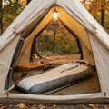 PolarShield mummy sleeping bag inside a warm lit camping tent